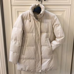 Beige 3/4 length puffer.